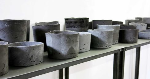 Resin-concrete vases on iron table